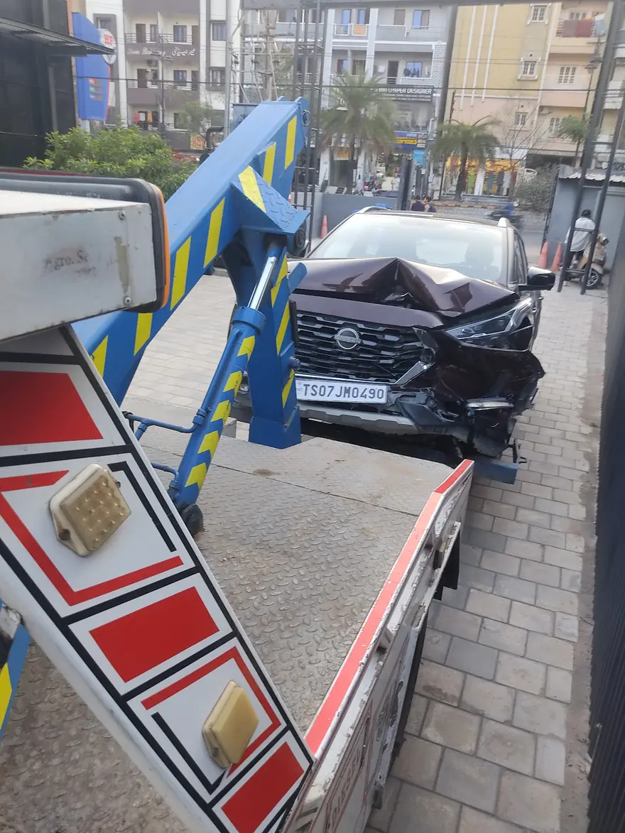 Accident damaged car being loaded on a tow truck